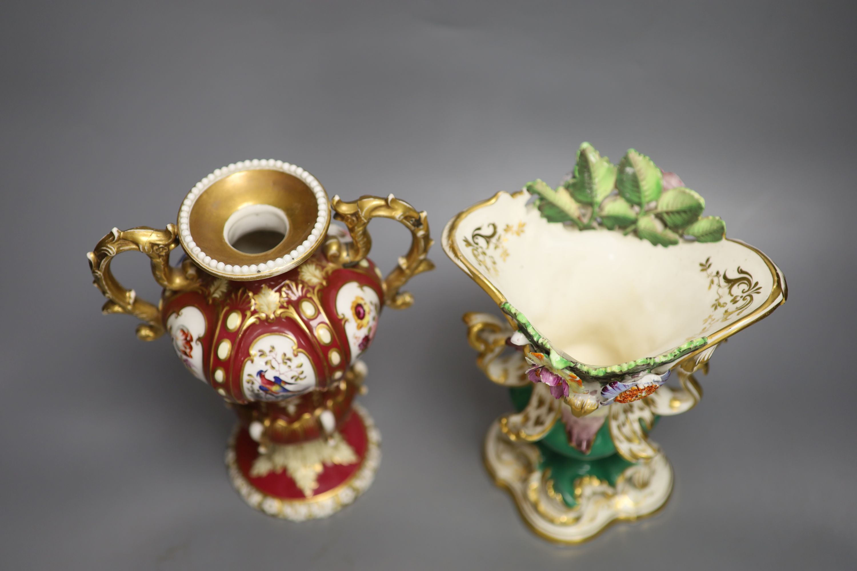 A Coalport two handled vase, with moulded leaves, CD mark in blue and an English crimson ground two handled vase, tallest 23cm